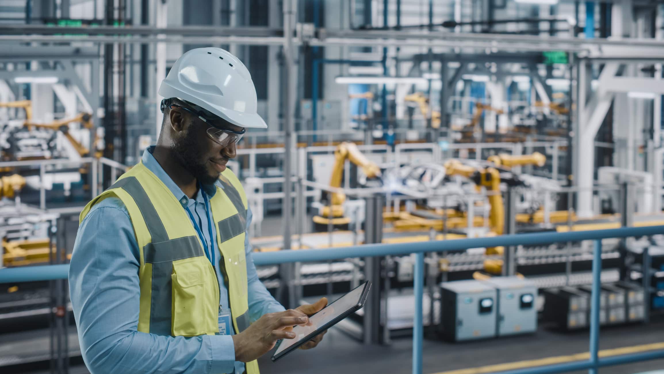 facility manager in industrial facility with checklist